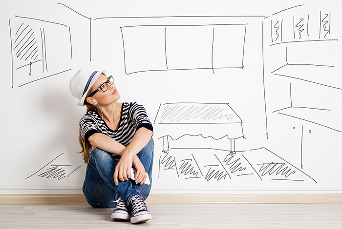 girl sitting dreaming of a home